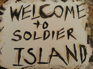 Welcome to Soldier Island sign for Halloween book club