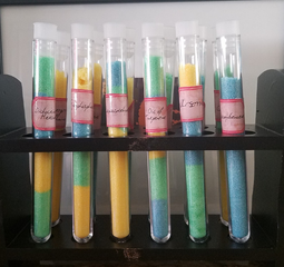 Colored sugar in test tubes for a sci-fi book party